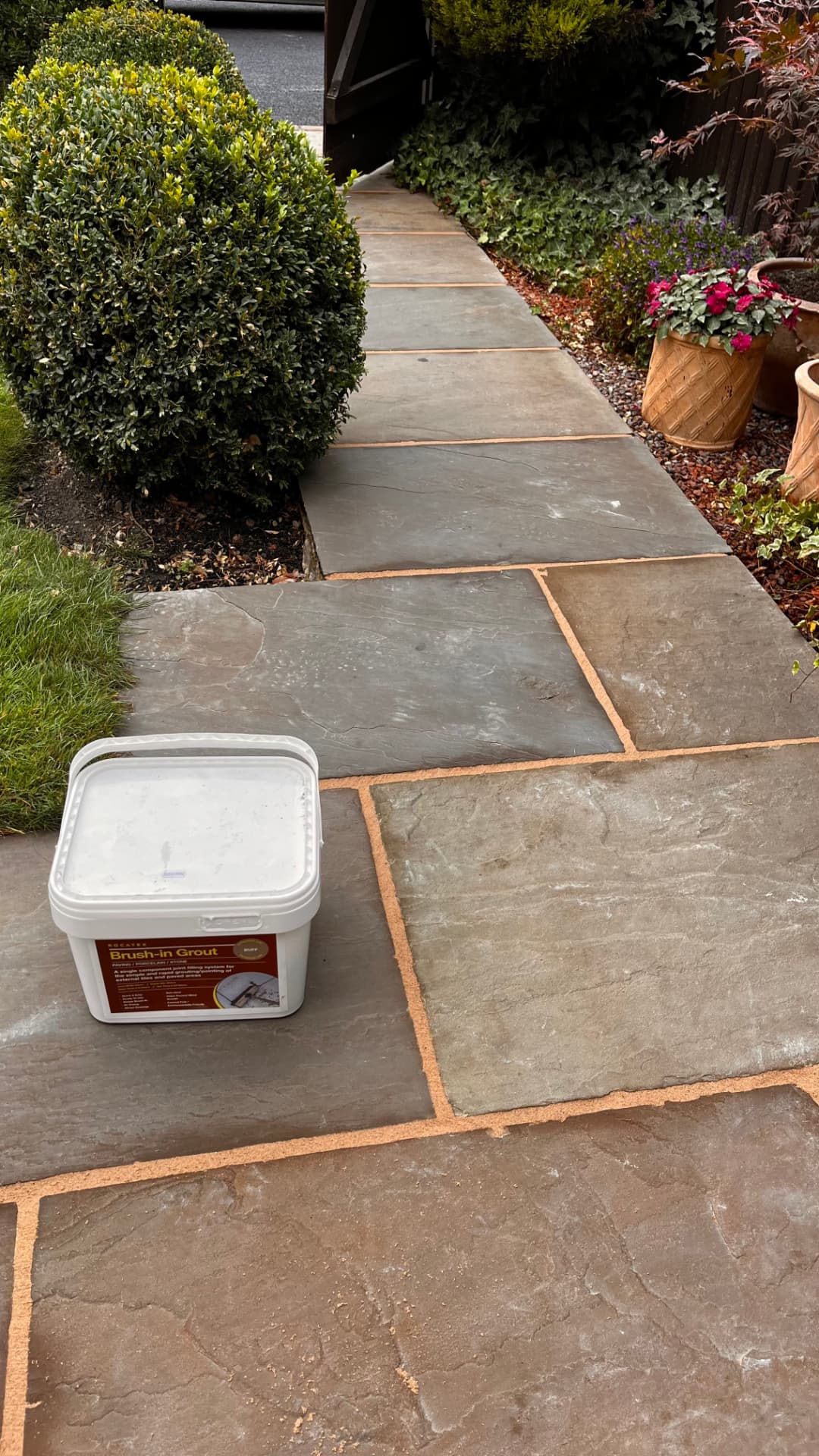 Patio slabs freshly repointed with brush-in grout
